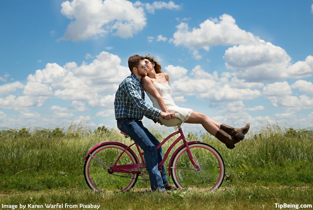 Couple Romance Bike Bicycle Ride Meadow Field Happy. Practice these relationship Skills for a Successful Marriage.