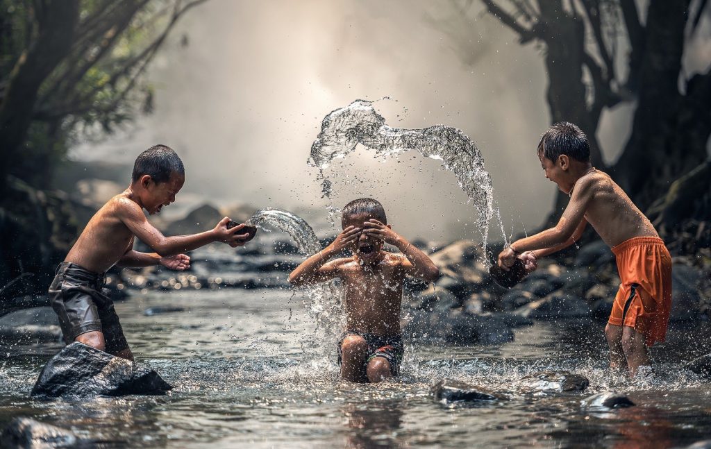 Water Capturing Against Light Water Photography - Boy Children Playing while Bathing in the River